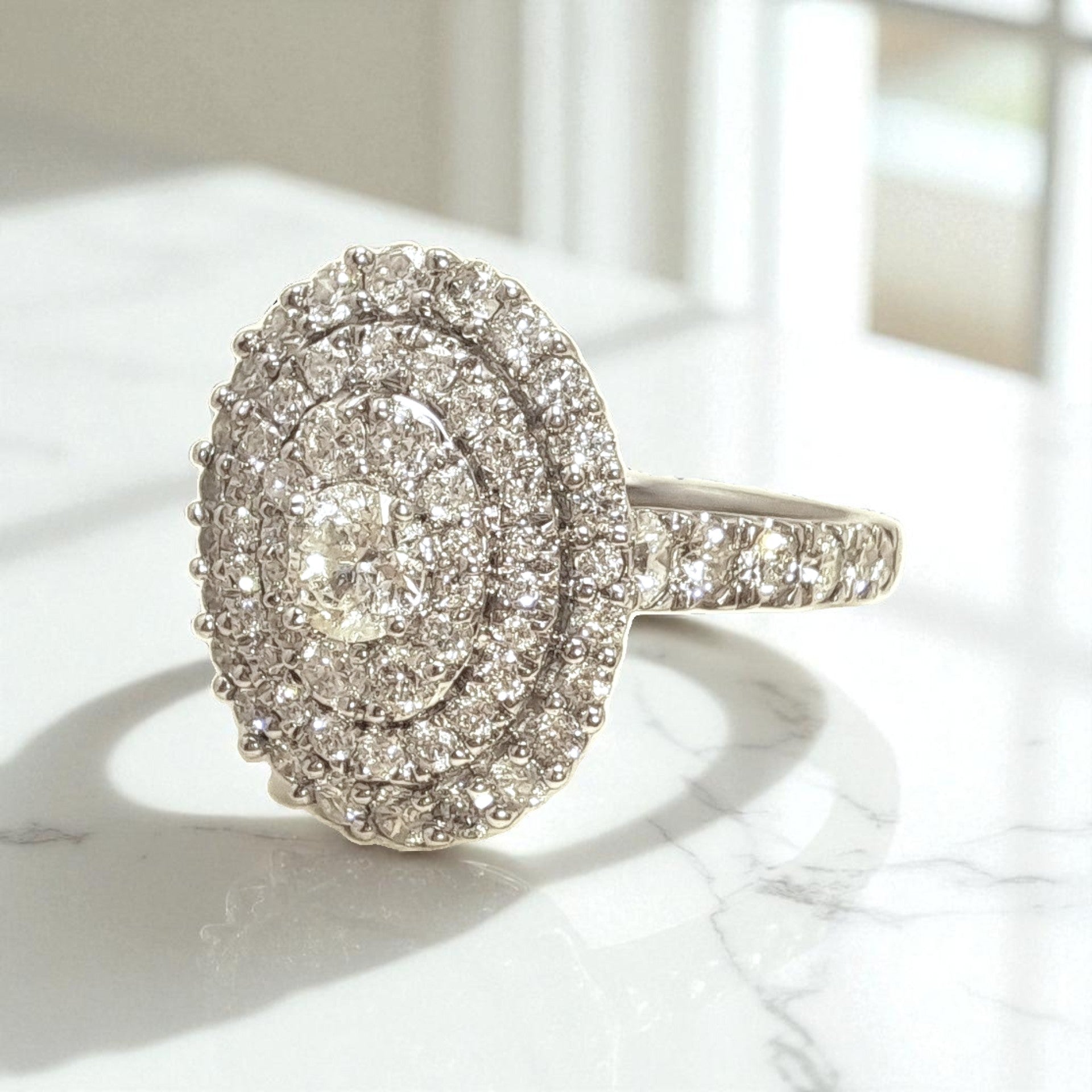 Vintage 'Celestia Oval' 18ct White Gold 1.25ct Diamond Oval Cluster Ring