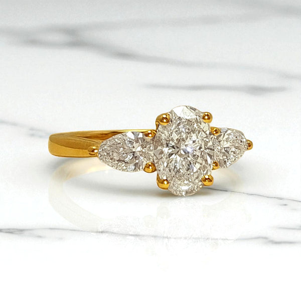 'Aurelia' - 18ct Yellow Gold 0.75ct Oval Diamond Engagement Ring with 0.40ct Pear Diamond Shoulders
